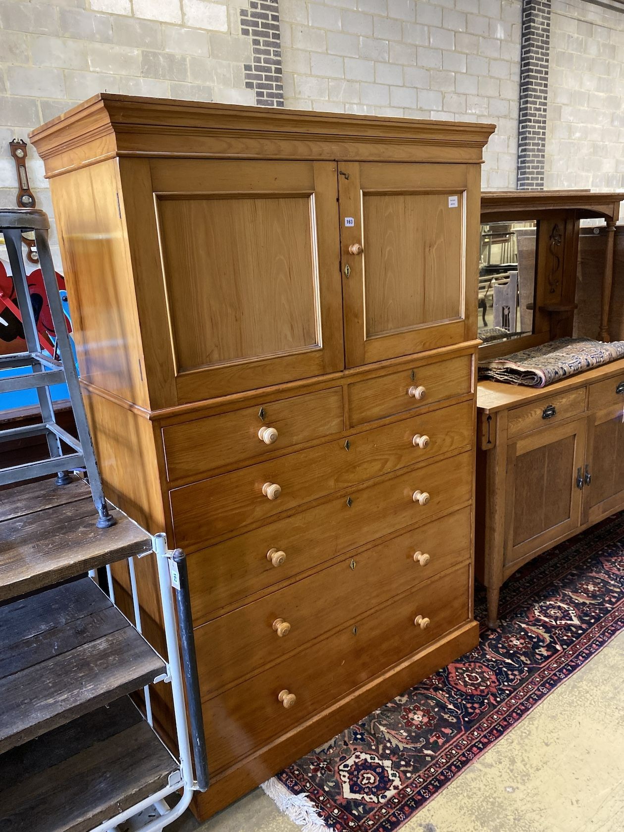 A Heal & Son, London Victorian pine cupboard on chest, width 120cm, depth 54cm, height 189cm